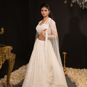 Lehenga: White Lucknowi Chikan with Pearl Embellished Bustier with Embellished Tulle Cape