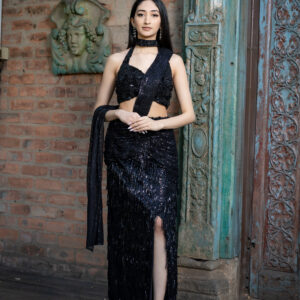 Pret: Black Monochromatic Embellished Sari-style Slit Skirt with Attached Drape & Halter Blouse